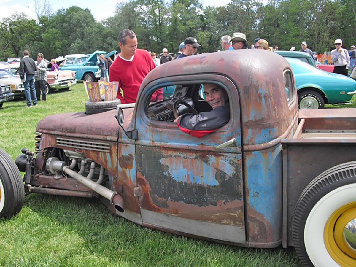 Jim Koscs in a "Rat Rod," with a 1946 Chevy truck cab attached to a home-built chassis, with 1937 Ford front suspension and a custom four-link rear suspension.. Finance a vintage car with #pfs_leasing